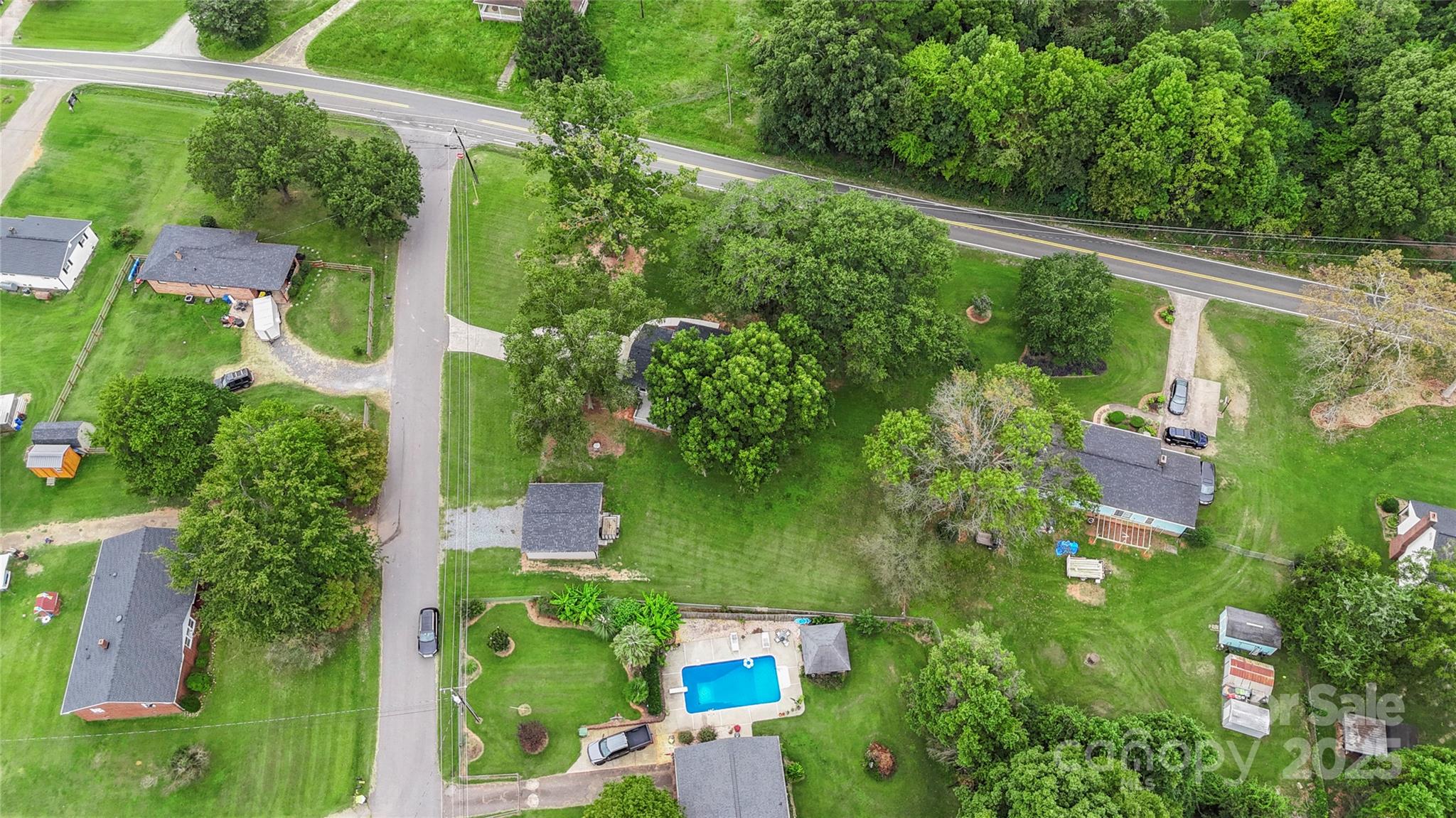 2302 Old Hickory Grove Road Mount Holly, NC 28120 - Photo 47 of 48 an aerial view of green landscape with trees houses and mountain view