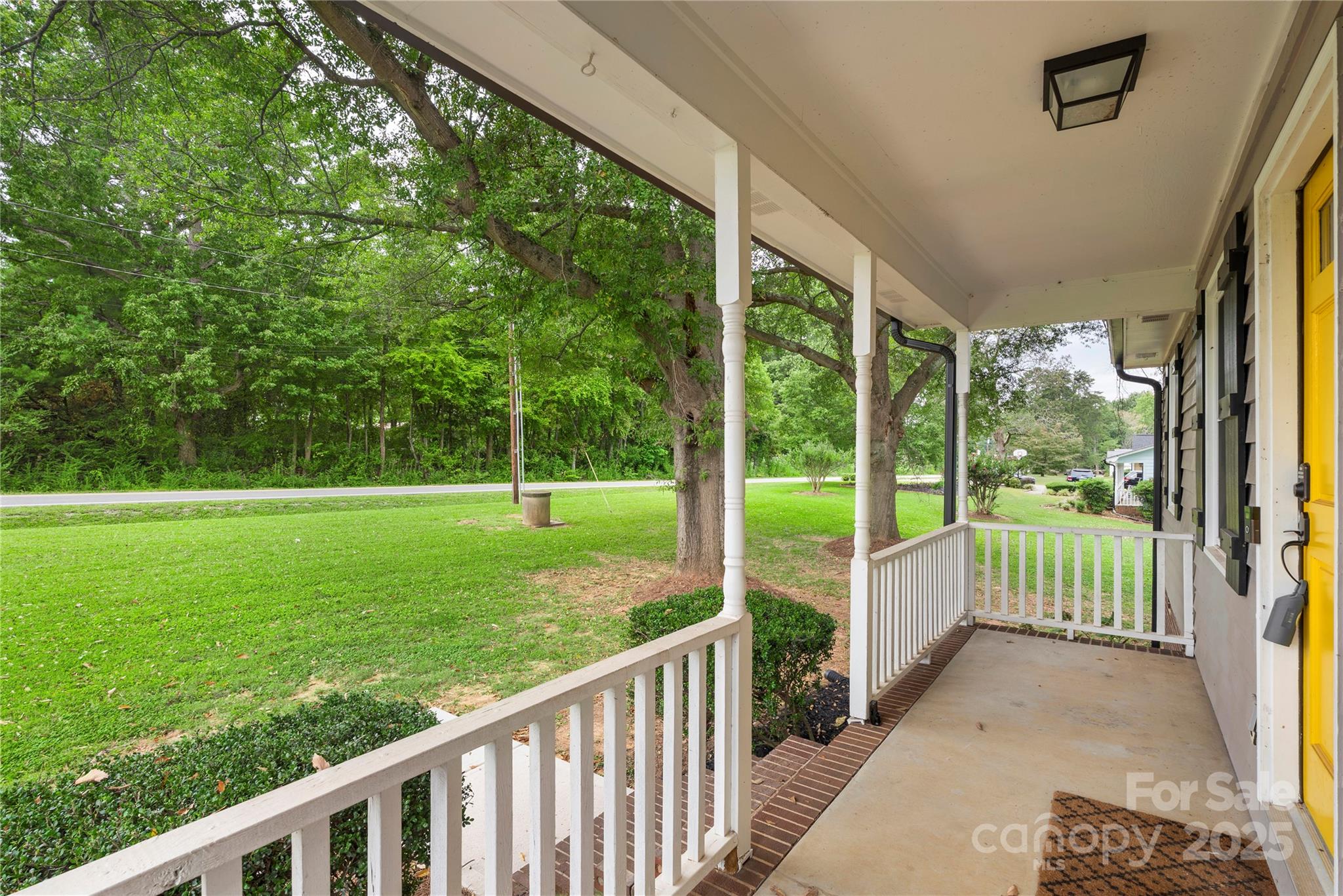 2302 Old Hickory Grove Road Mount Holly, NC 28120 - Photo 10 of 48 a view of a porch with a big yard