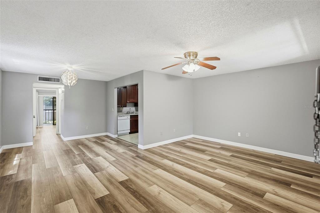 11709 Raintree Village Boulevard, Unit C Temple Terrace, FL 33617 - Photo 4 of 23 a view of an empty room with a ceiling fan