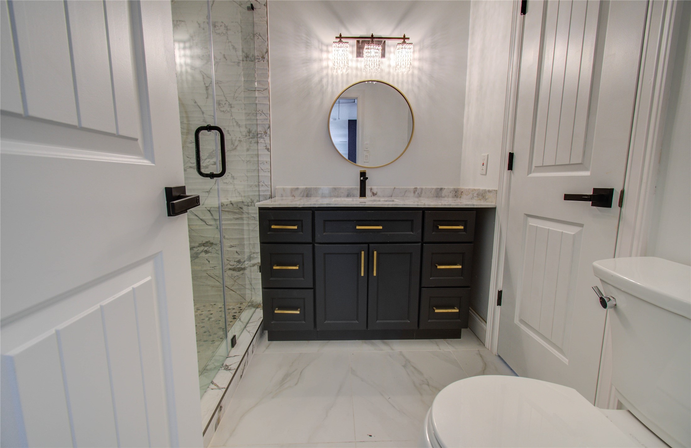 10300 Mayfield Road Houston, TX 77043 - Photo 13 of 32 a bathroom with a sink a toilet and shower