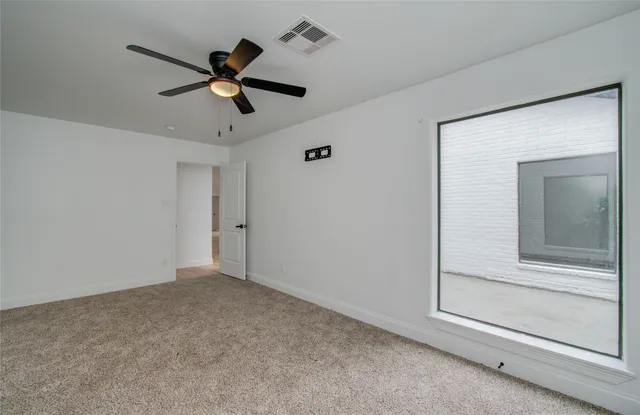 a view of room with ceiling fan