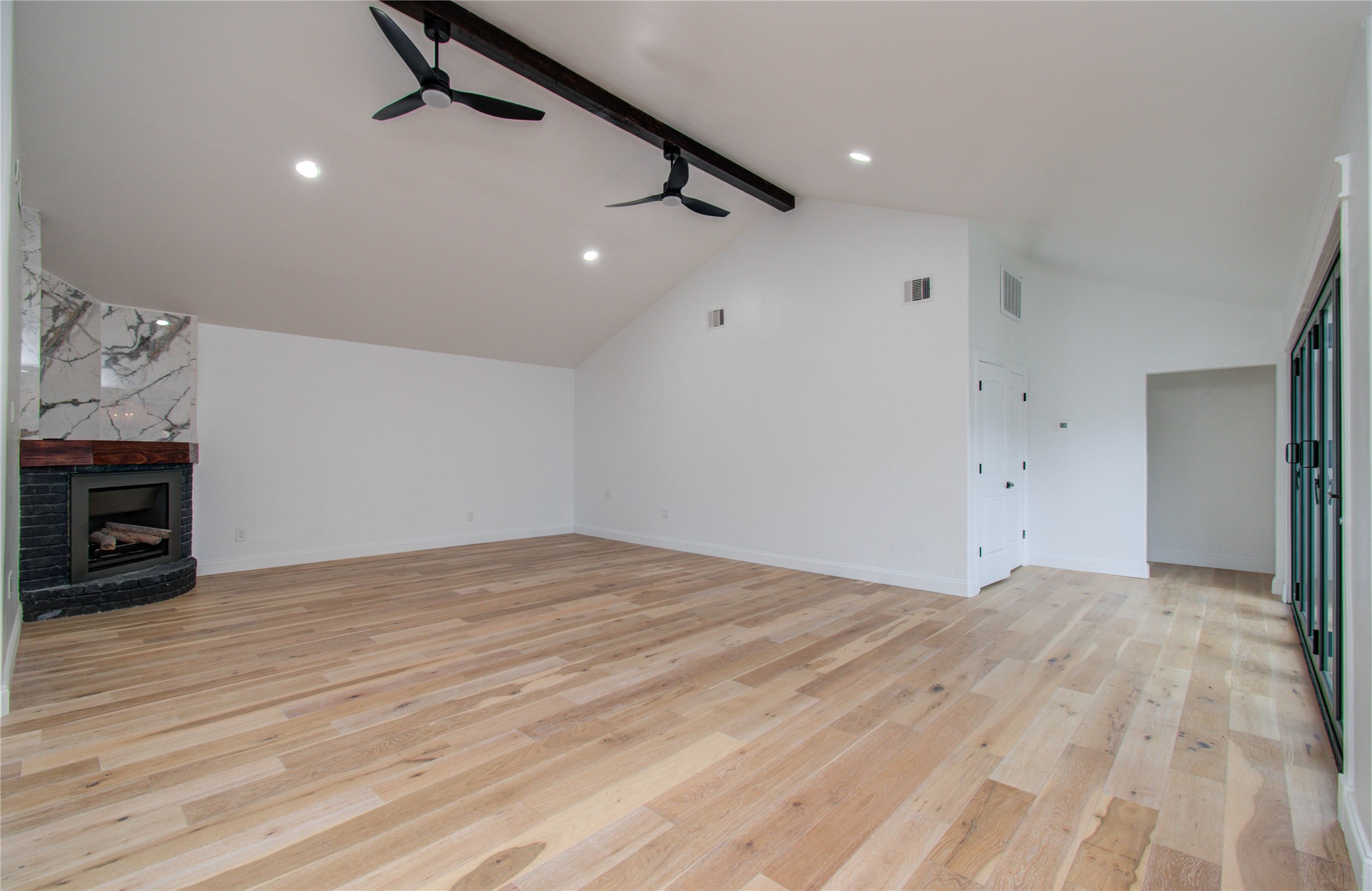10300 Mayfield Road Houston, TX 77043 - Photo 17 of 32 a view of empty room with wooden floor and ceiling fan
