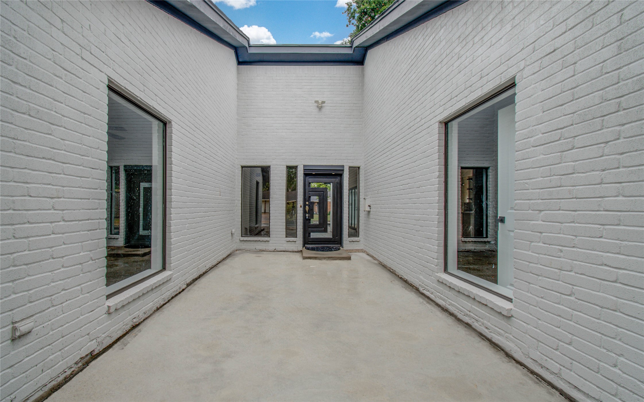 10300 Mayfield Road Houston, TX 77043 - Photo 2 of 32 a view of an entryway of the house