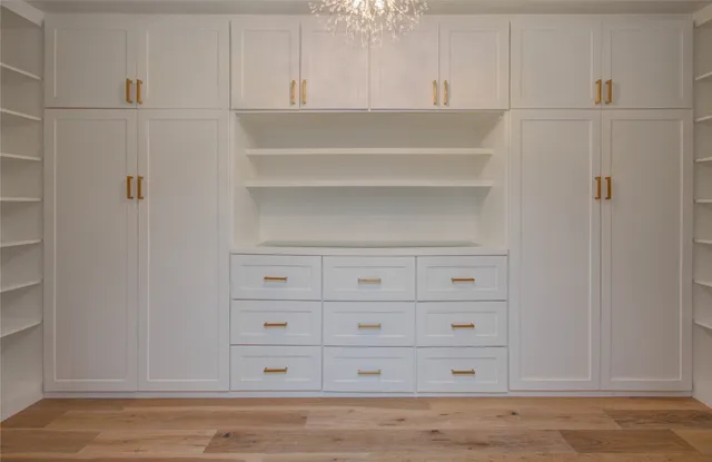 a view of a closet with cabinet