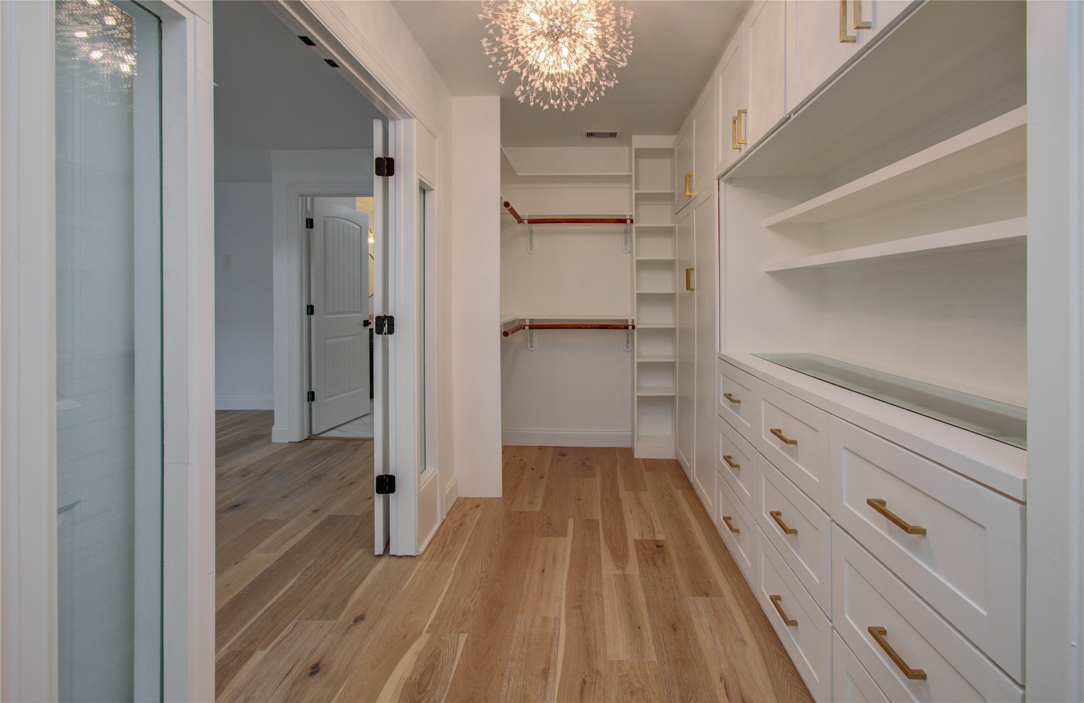 10300 Mayfield Road Houston, TX 77043 - Photo 26 of 32 a view of a hallway with wooden floor and staircase