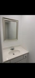 3740 Inverrary Drive, Unit 1A Lauderhill, FL 33319 - Photo 18 of 20 a bathroom with a sink