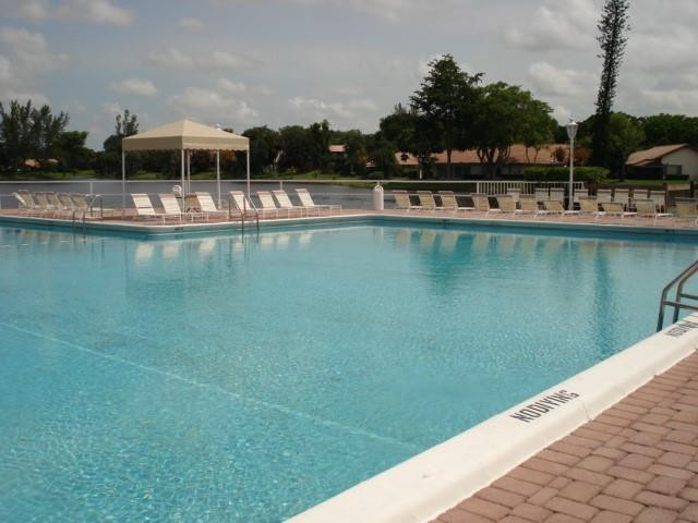 3740 Inverrary Drive, Unit 1A Lauderhill, FL 33319 - Photo 4 of 20 a view of a lake with a nearby beach