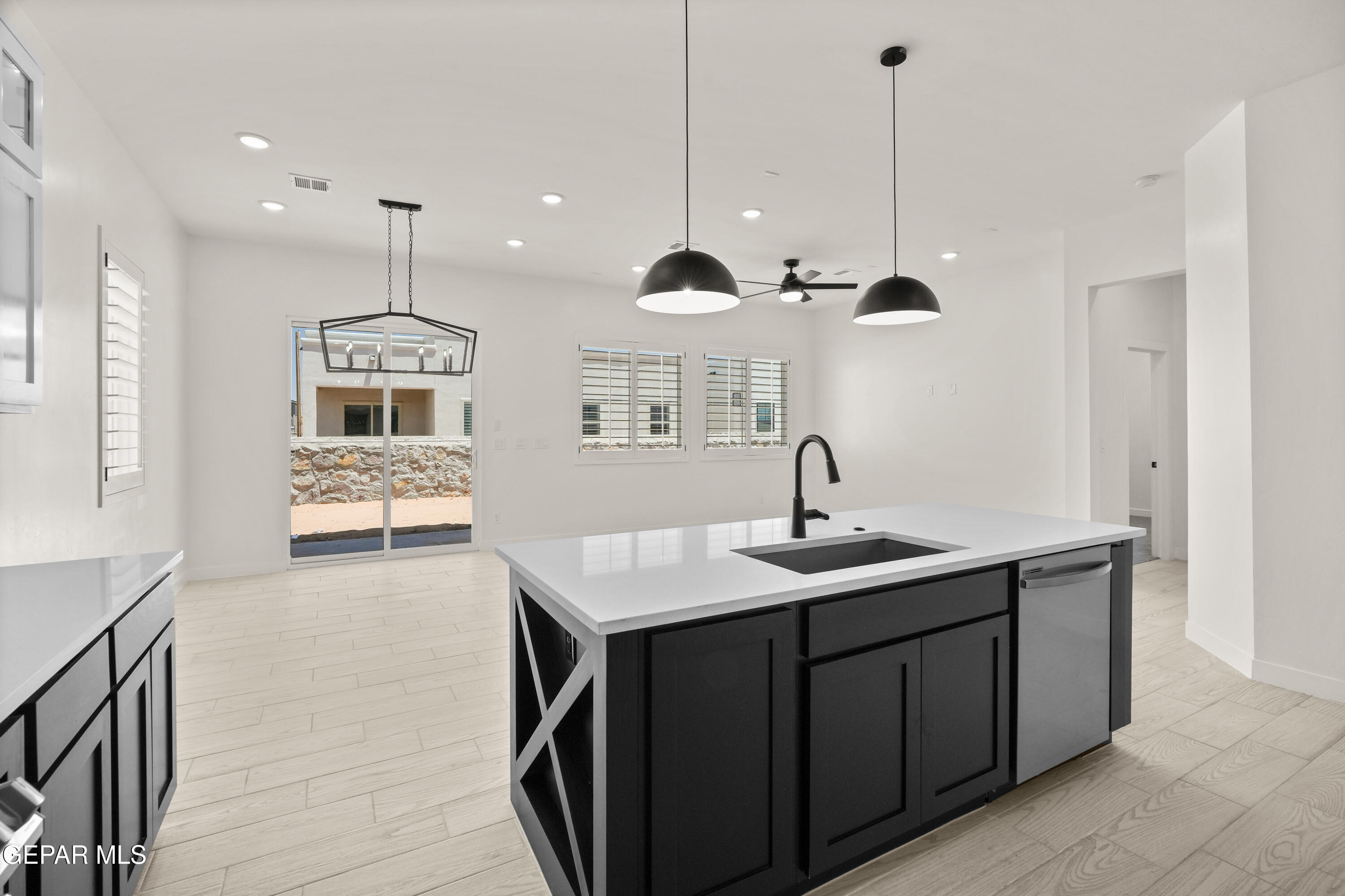 1810 Schyler Love Lane El Paso, TX 79928 - Photo 11 of 37 a kitchen with kitchen island white cabinets and sink