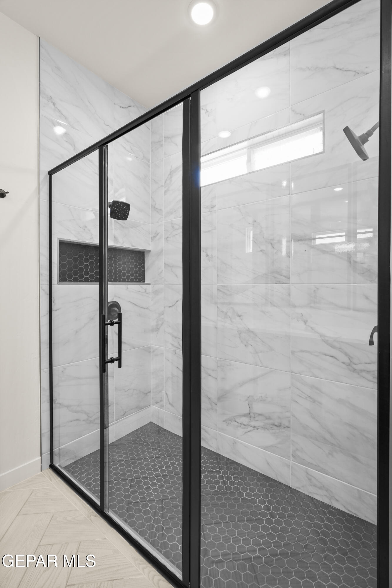 1810 Schyler Love Lane El Paso, TX 79928 - Photo 23 of 37 a bathroom with a glass shower door
