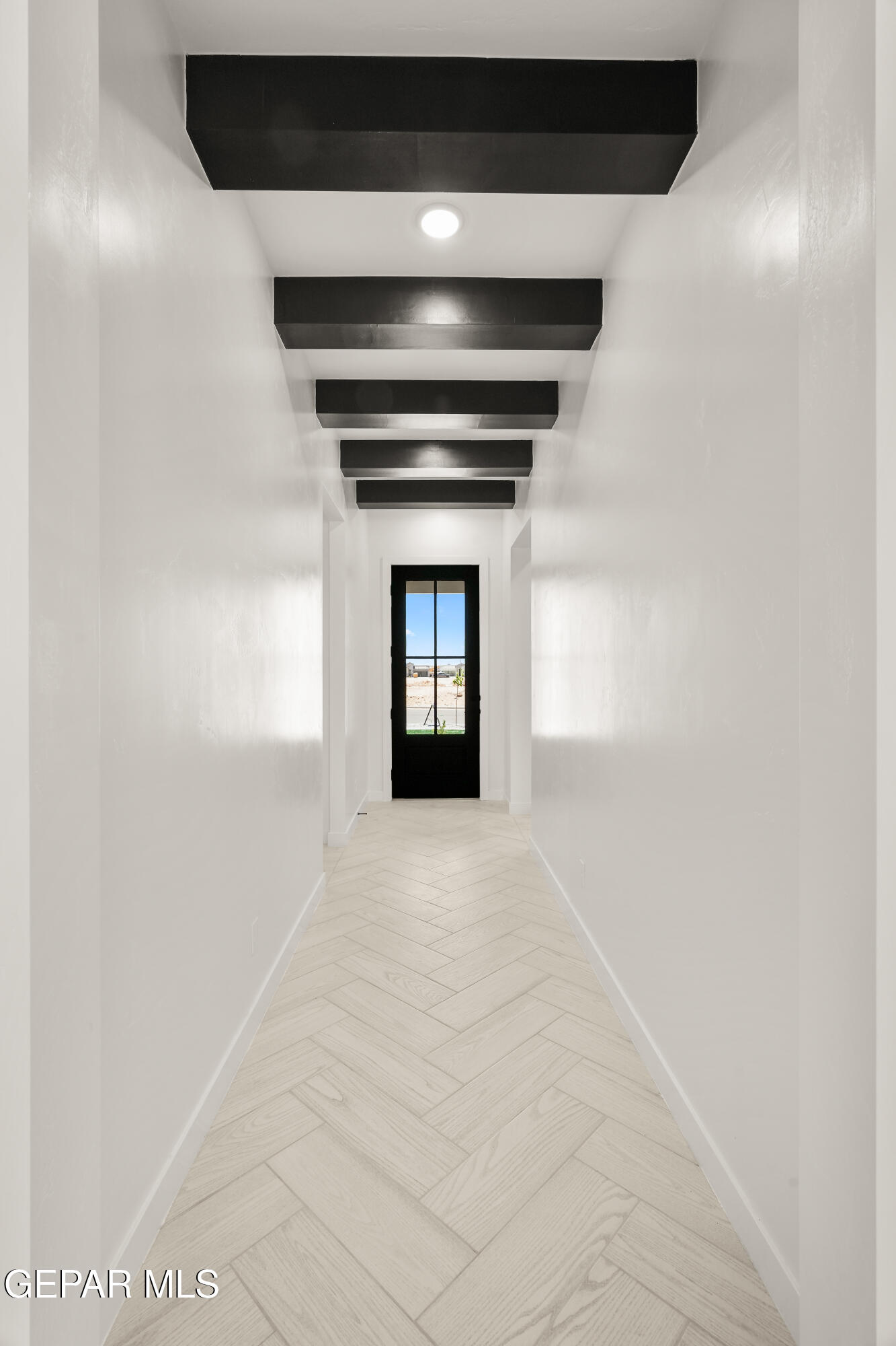 1810 Schyler Love Lane El Paso, TX 79928 - Photo 3 of 37 a view of an empty room with wooden floor and a window