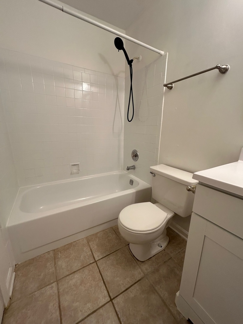 2020 North Rand Road, Unit 109 Palatine, IL 60074 - Photo 13 of 13 a bathroom with a toilet sink and shower