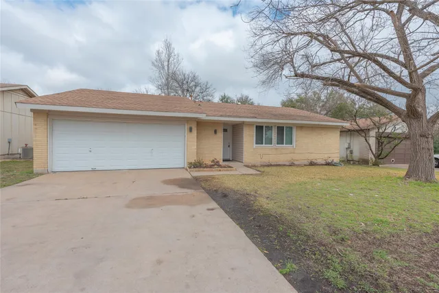 a house view with a backyard space