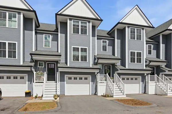 an aerial view of a house with patio outdoor seating