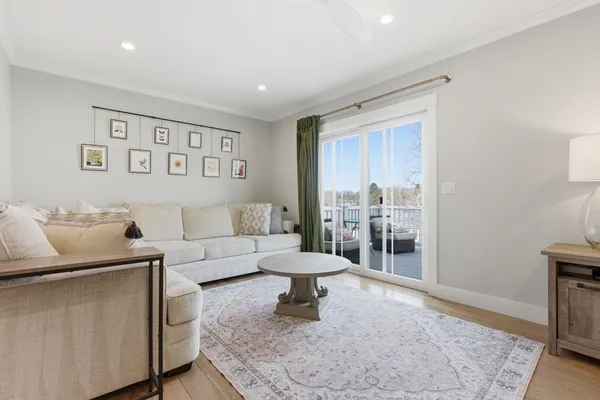 a living room with furniture and a rug