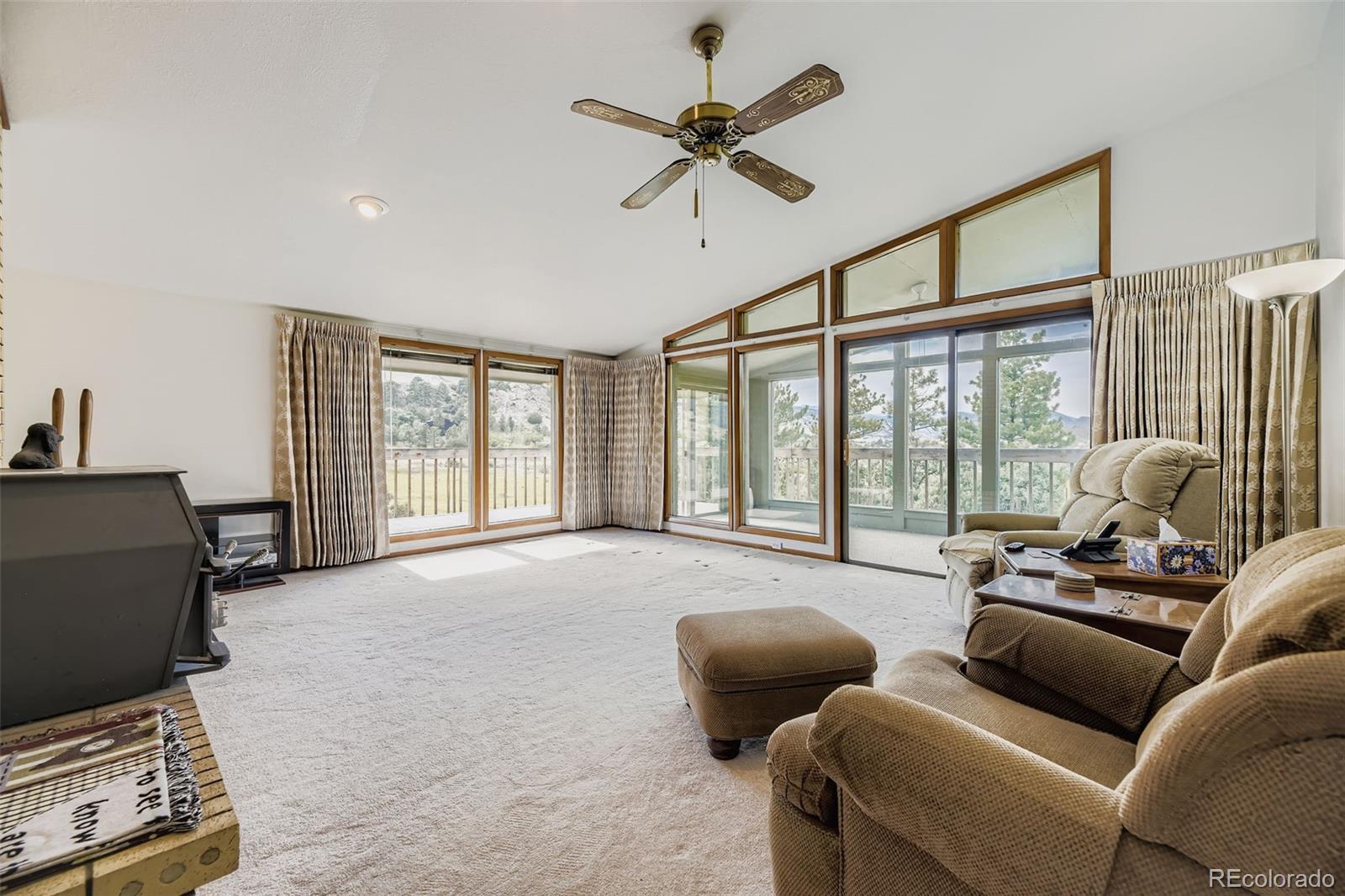 5040 Pine Ridge Road Golden, CO 80403 - Photo 14 of 41 a living room with furniture and a large window