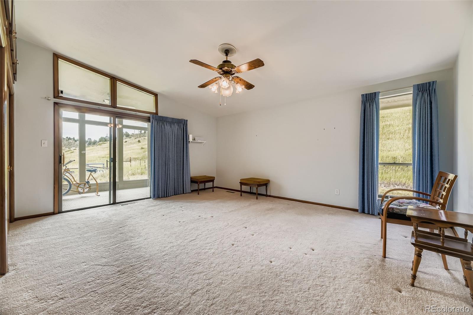 5040 Pine Ridge Road Golden, CO 80403 - Photo 21 of 41 a view of a livingroom with furniture and windows