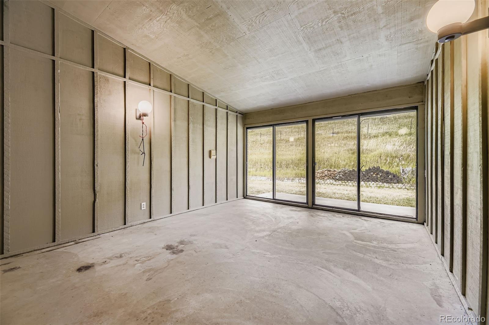 5040 Pine Ridge Road Golden, CO 80403 - Photo 34 of 41 a view of an empty room with a sliding door