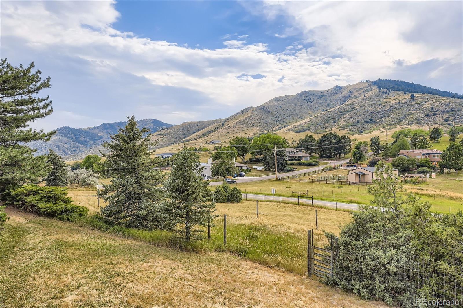 5040 Pine Ridge Road Golden, CO 80403 - Photo 7 of 41 a view of a lake with a mountain