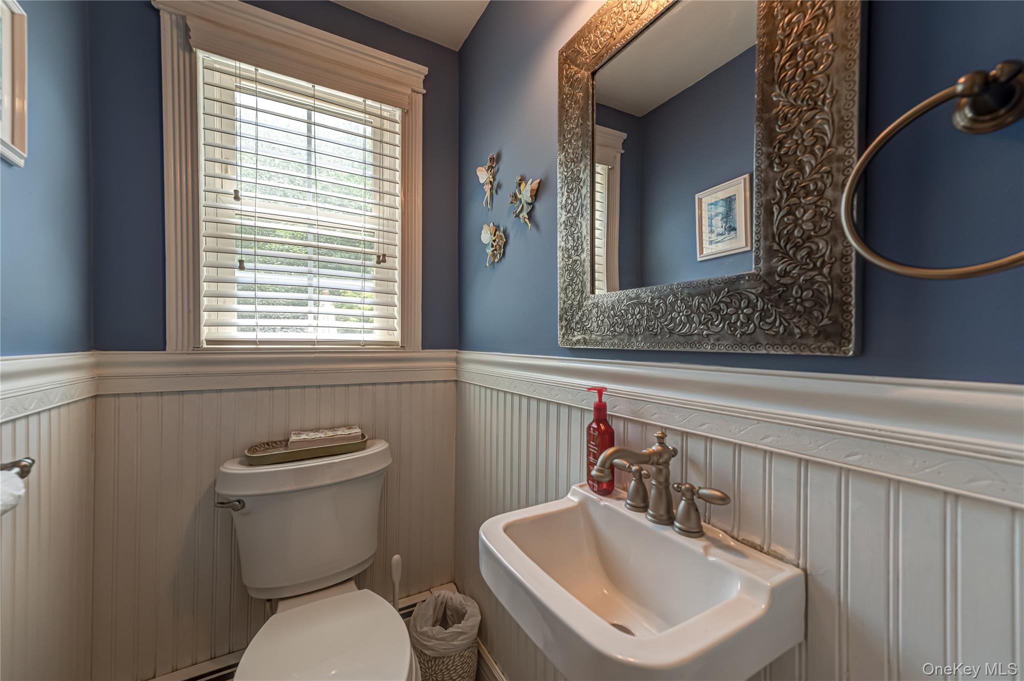 3 Thompson Hill Road St. James, NY 11780 - Photo 13 of 34 a bathroom with a sink a toilet and a mirror