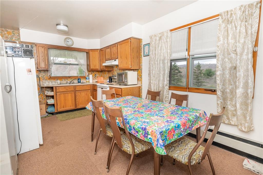 142 East Run Road Marion Center, PA 15759 - Photo 8 of 20 a dining room with a table chairs and a kitchen