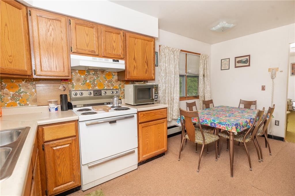 142 East Run Road Marion Center, PA 15759 - Photo 9 of 20 a kitchen with stainless steel appliances granite countertop a table chairs sink and cabinets