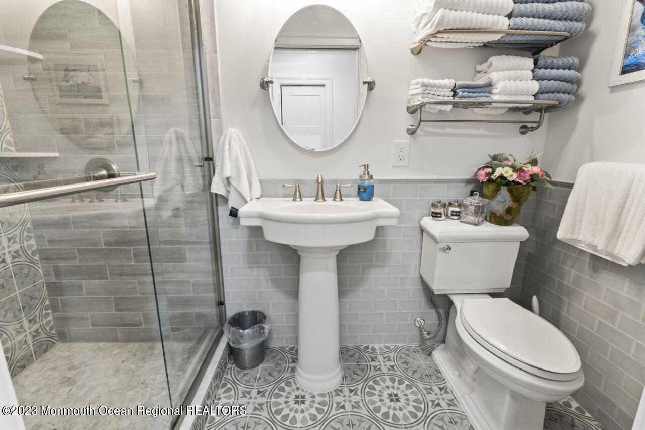 110 Stillwater Road Barnegat, NJ 08005 - Photo 11 of 35 a bathroom with a sink a toilet and a mirror