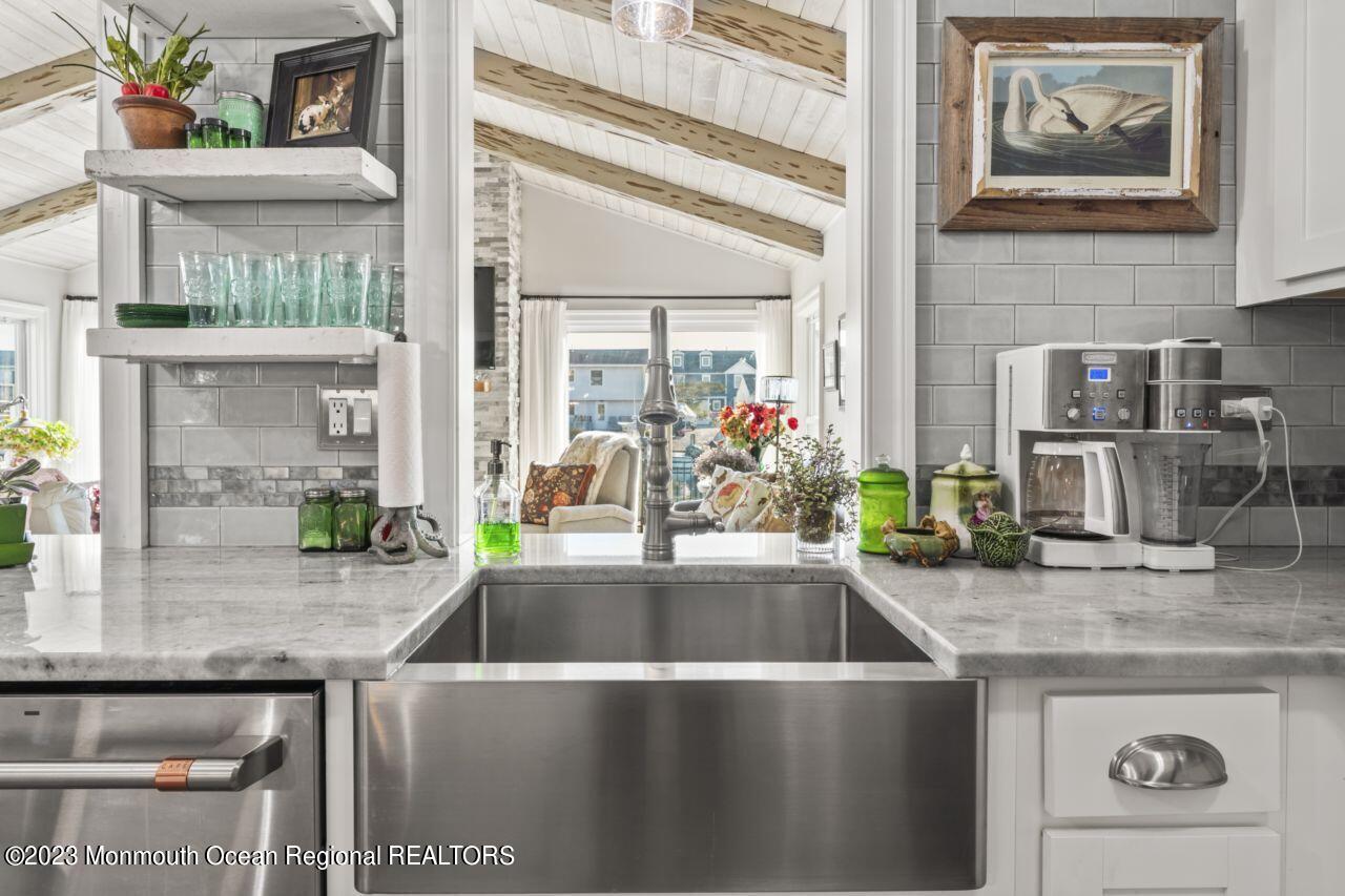 110 Stillwater Road Barnegat, NJ 08005 - Photo 15 of 35 a kitchen with a sink and a refrigerator