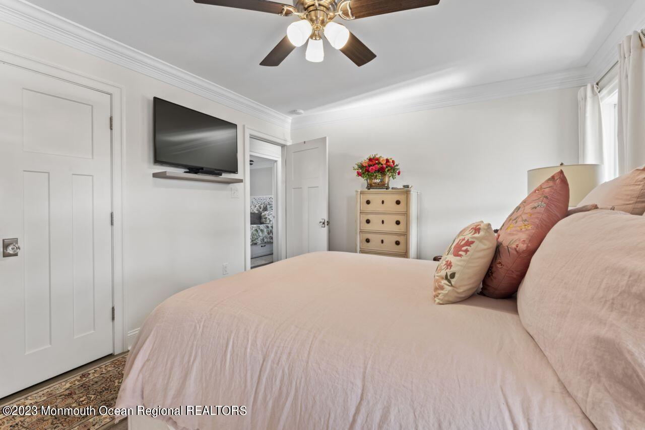 110 Stillwater Road Barnegat, NJ 08005 - Photo 25 of 35 a bedroom with a large bed and a flat tv screen