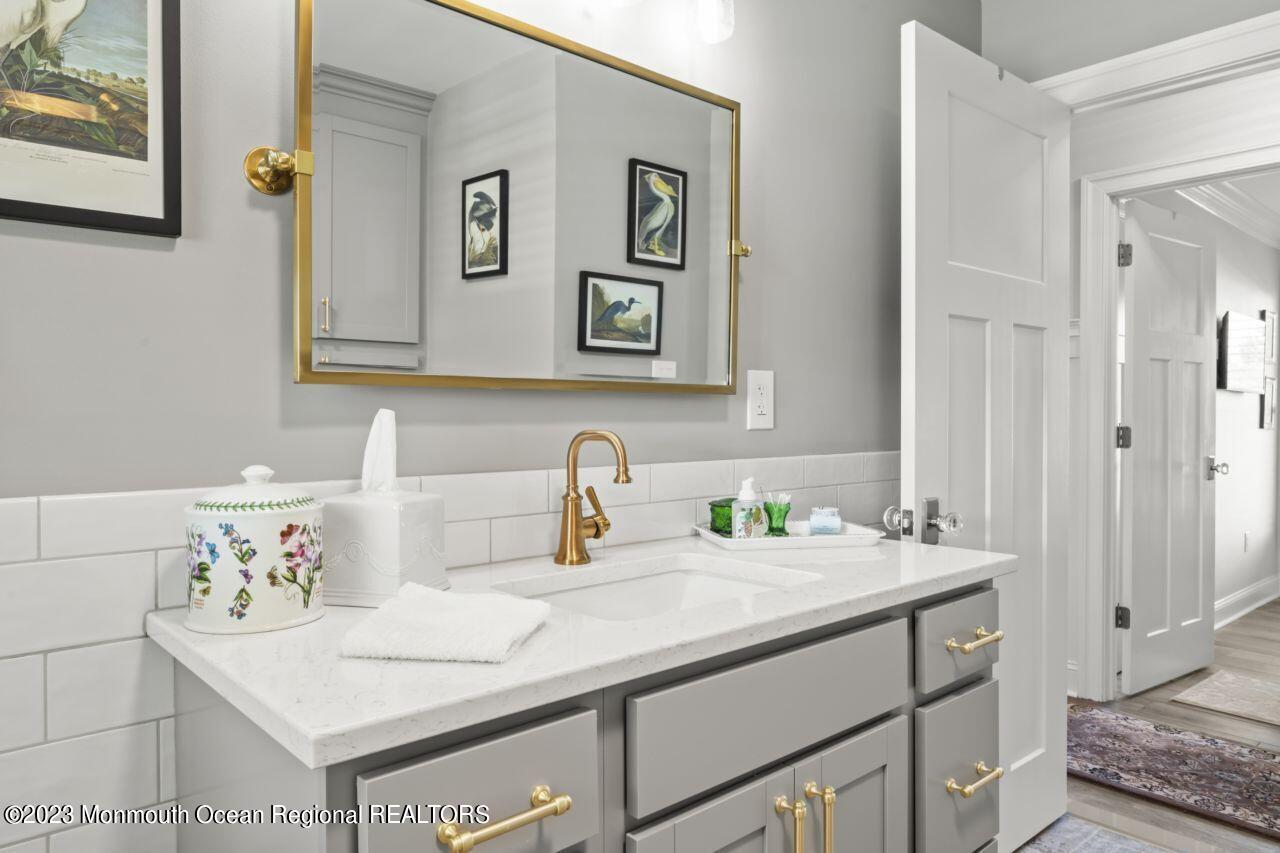 110 Stillwater Road Barnegat, NJ 08005 - Photo 30 of 35 a bathroom with a sink and a mirror