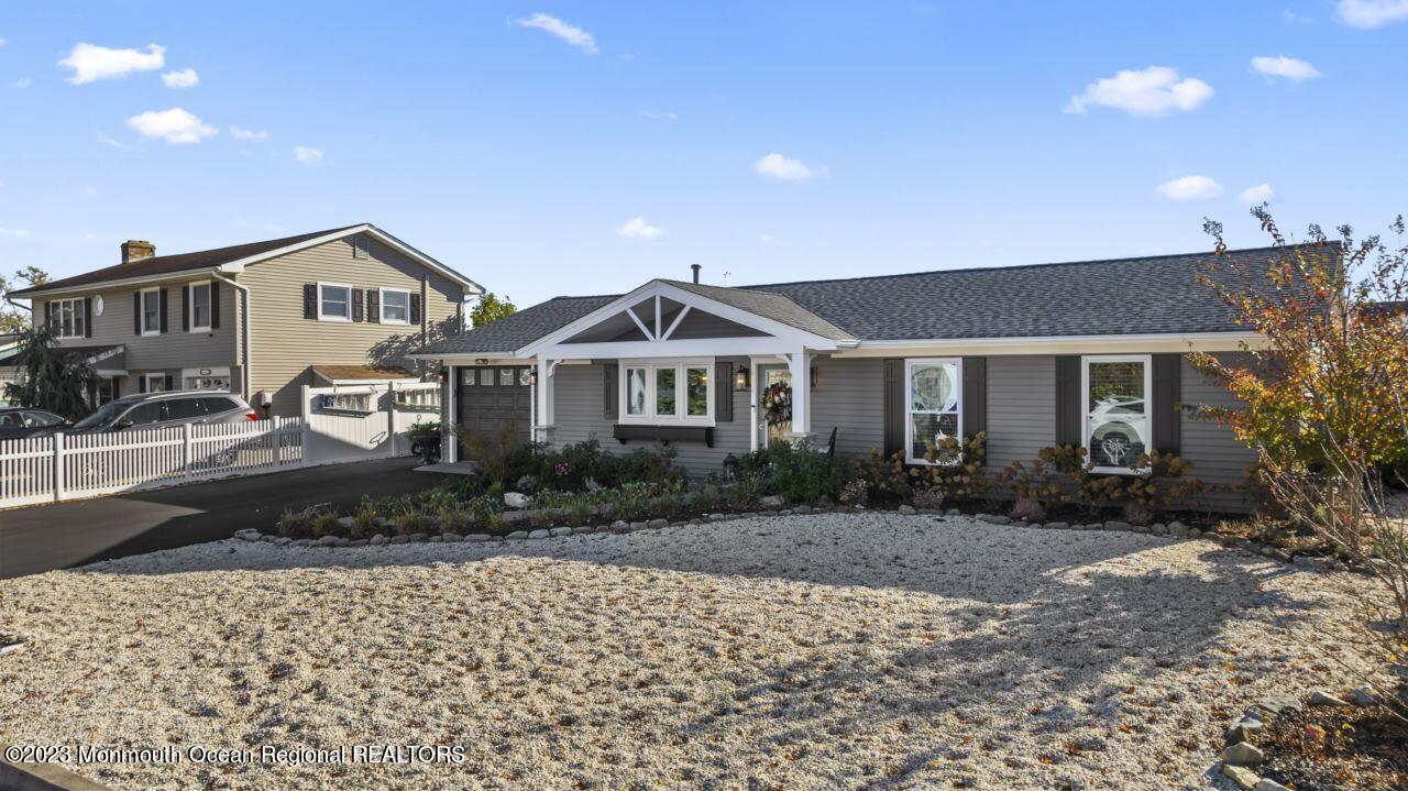 110 Stillwater Road Barnegat, NJ 08005 - Photo 3 of 35 a front view of a house with a garden