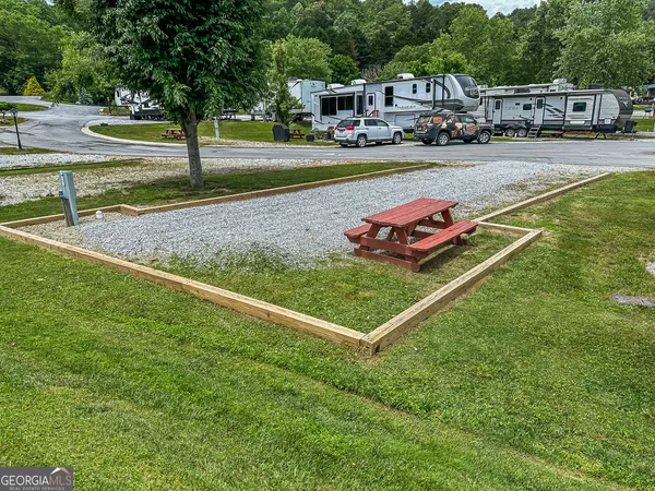 a view of yard with cars parked