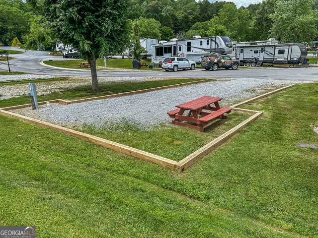 a view of yard with cars parked