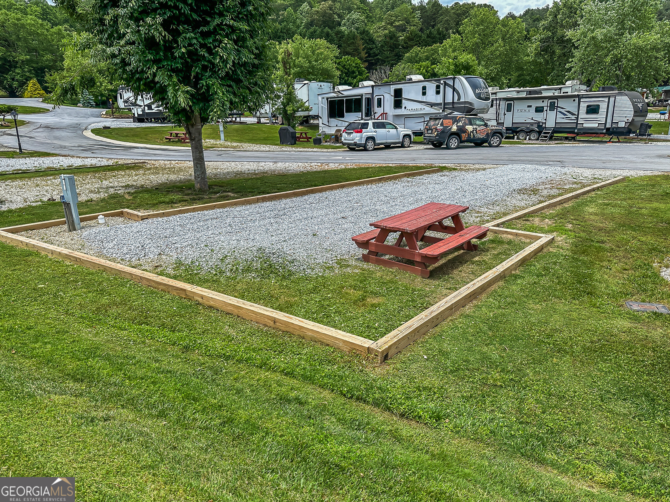 a view of yard with cars parked