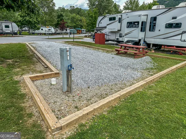 a childrens park with lots of swings and slides