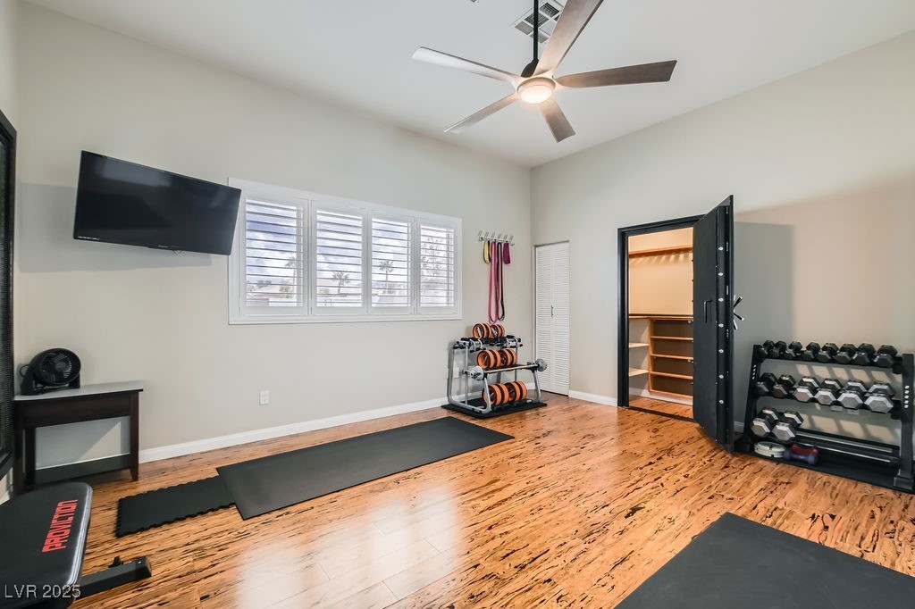 647 Foxhall Road Henderson, NV 89002 - Photo 25 of 82 Workout area with baseboards, visible vents, wood finished floors, and ceiling fan