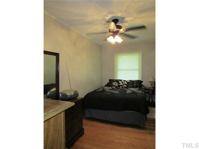 119 Gregory Street Roxboro, NC 27573 - Photo 11 of 21 Bedroom 2 is located at end of hallway next to second bath.