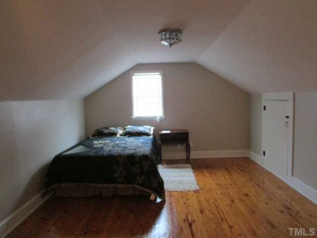 119 Gregory Street Roxboro, NC 27573 - Photo 16 of 21 One of the two bedrooms upstairs. They are very similar. Owner is using one for storage.