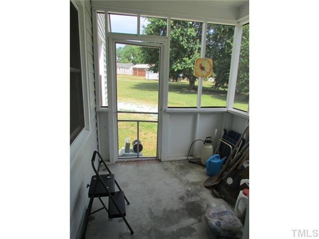 119 Gregory Street Roxboro, NC 27573 - Photo 17 of 21 Screened in back porch used for storage but would make a great area for a caf? table and sipping morning coffee and listening to the birds sing.
