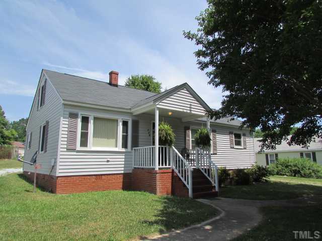 119 Gregory Street Roxboro, NC 27573 - Photo 19 of 21 Circular drive has side walk going to front door from either side, crepe myrtle trees in the front provide shade on the porch.