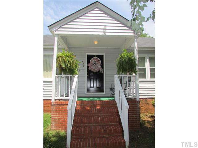 119 Gregory Street Roxboro, NC 27573 - Photo 2 of 21 Covered front porch has room for rocking chairs, ferns and flower pots.