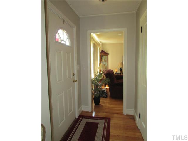 119 Gregory Street Roxboro, NC 27573 - Photo 3 of 21 The foyer is the divider for the family room and dining room. Door to the right goes to the upstairs
