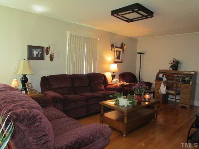 119 Gregory Street Roxboro, NC 27573 - Photo 4 of 21 The family room offer good lighting from the updated insulated windows and has beautiful refinished hardwood floor