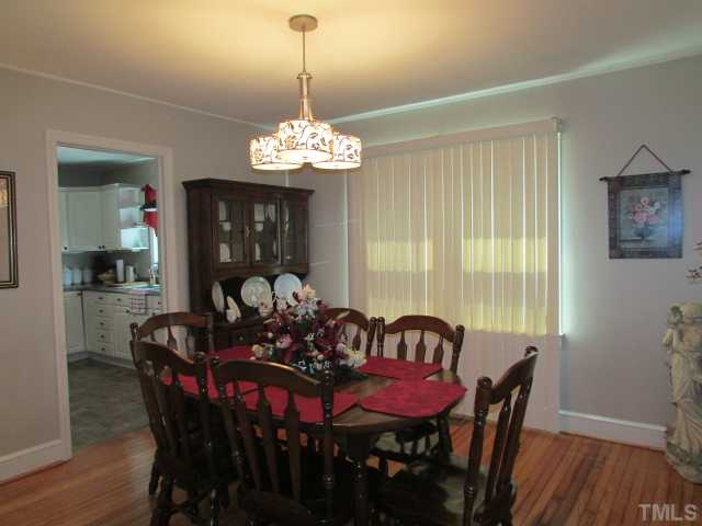 119 Gregory Street Roxboro, NC 27573 - Photo 7 of 21 Dining room has opening to kitchen.