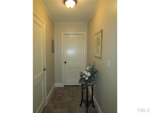 119 Gregory Street Roxboro, NC 27573 - Photo 9 of 21 This hallway leads to the second bath (on left) and back bedroom (end)