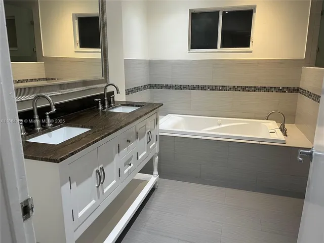 a bathroom with a sink and a bathtub