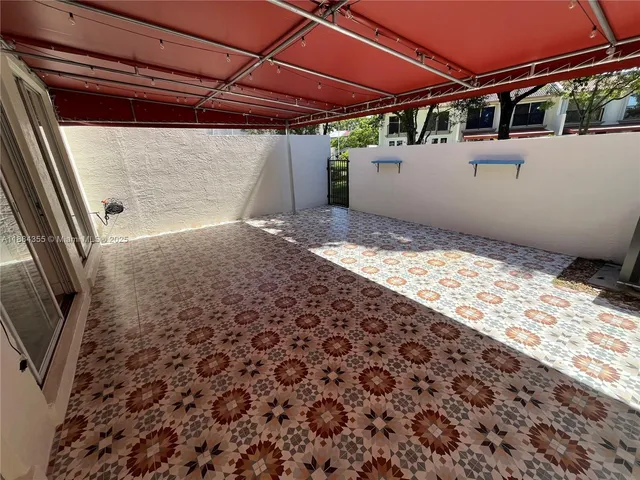 a view of a backyard of the house