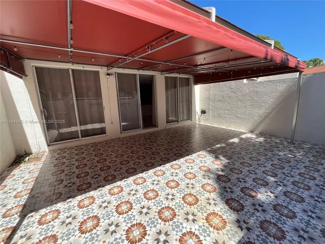 a view of a backyard of the house