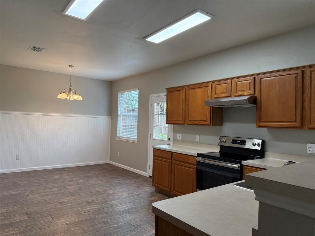 909 Carthage Way Arlington, TX 76017 - Photo 8 of 31 You can store a lot of things in all these cabinets The pantry off the utility area is huge too