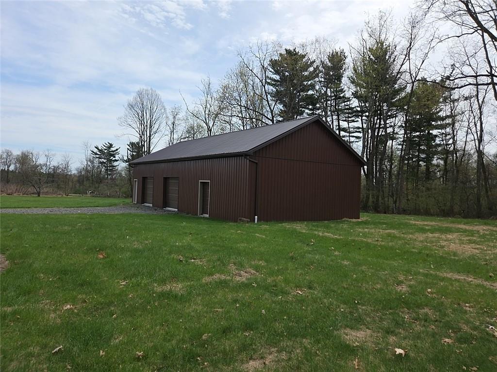 460 Beaver Run Road Apollo, PA 15613 - Photo 36 of 47 a house that is sitting in the grass with tress in the background