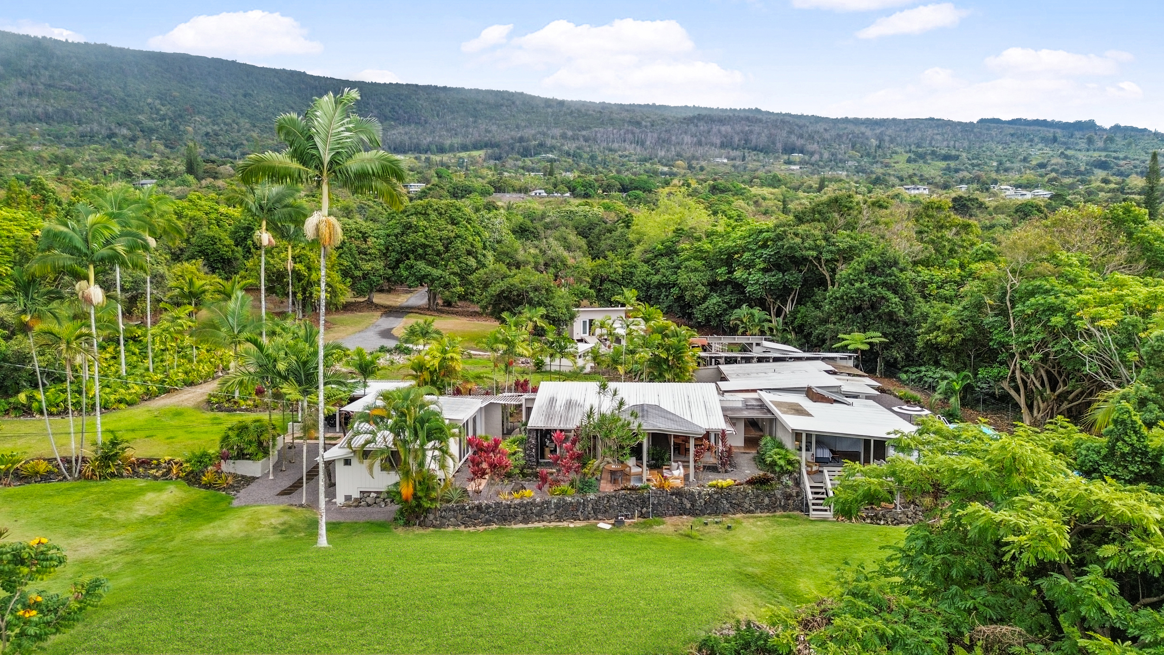 83-5369 Manako Road Captain Cook, HI 96704 - Photo 13 of 30 an aerial view of residential houses with outdoor space and trees